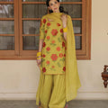 Woman in yellow shalwar kameez with red floral embroidery and matching dupatta